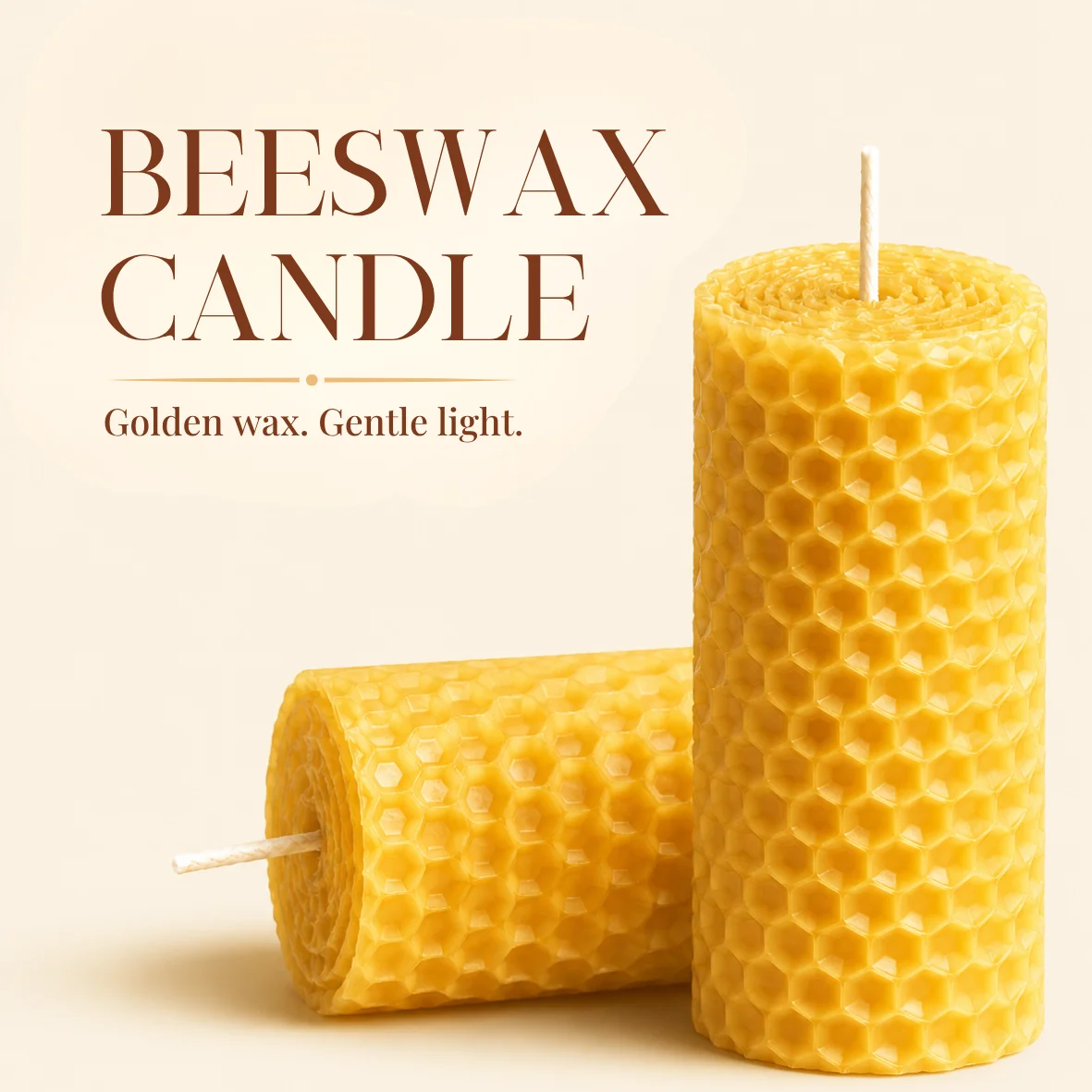bioQ graphic headed beeswax candle, golden wax, gentle light, showing two honeycomb-textured candles — one upright and one lying down with its wick towards the viewer