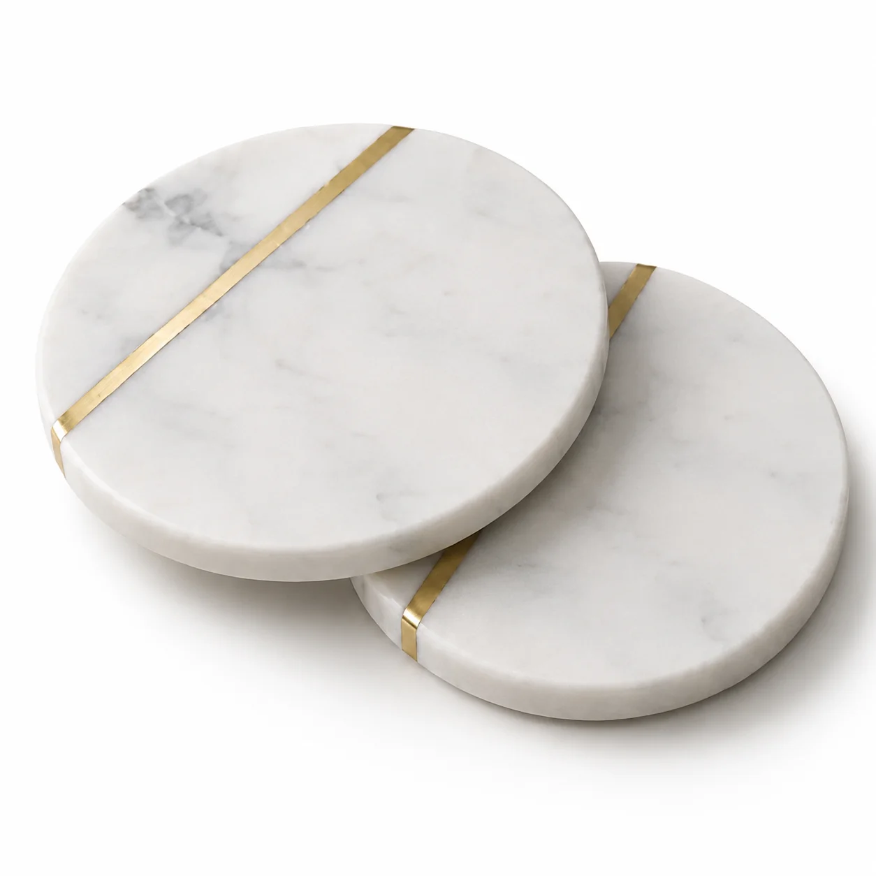 Two round white marble coasters, each with a brass inlay line