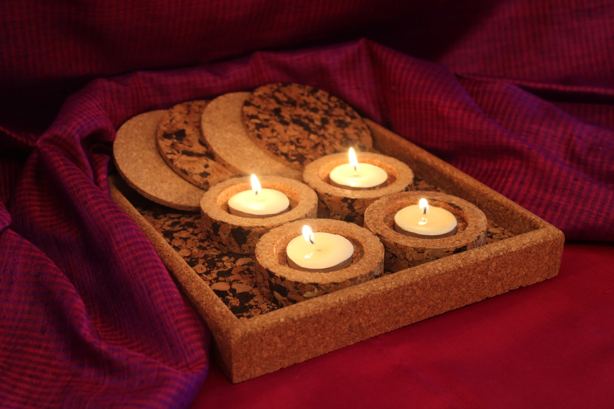 SC801 cork tray and lit diyas arranged for a festive handover