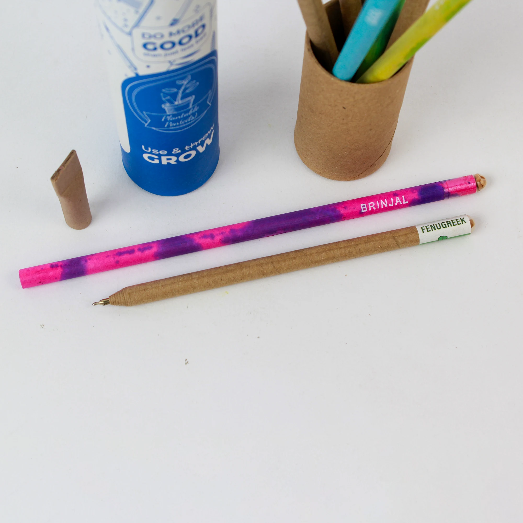 Plantable pen and pencil set shown with its paper tube